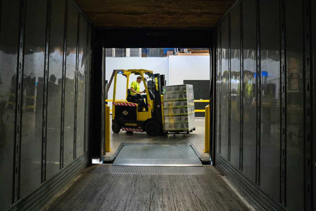 A forklift driver in a warehouse