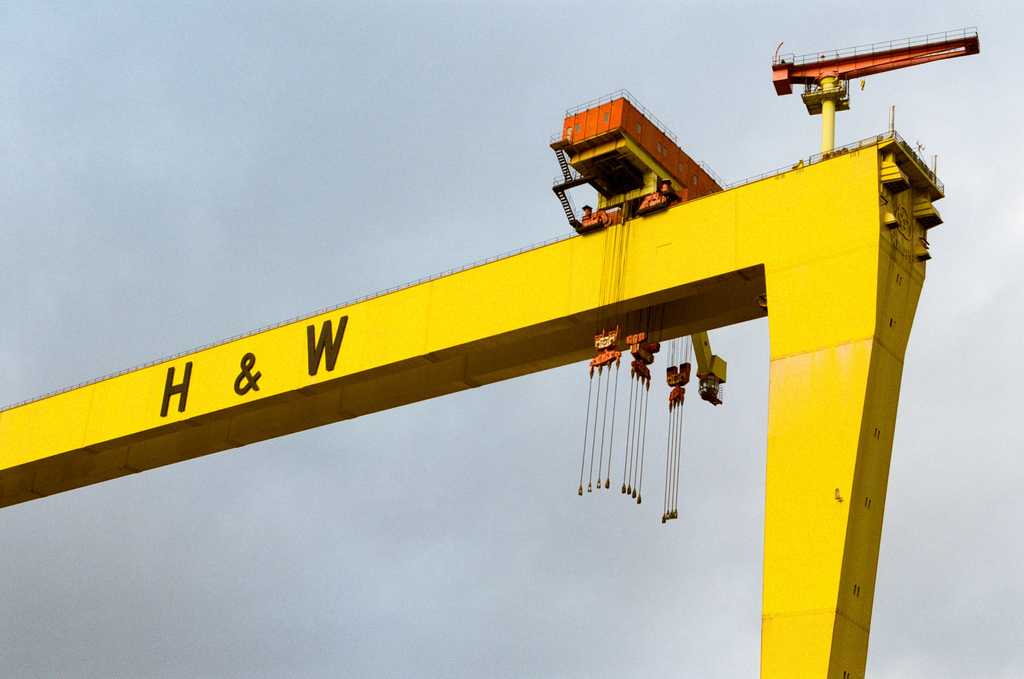 Crane arm lifting a container